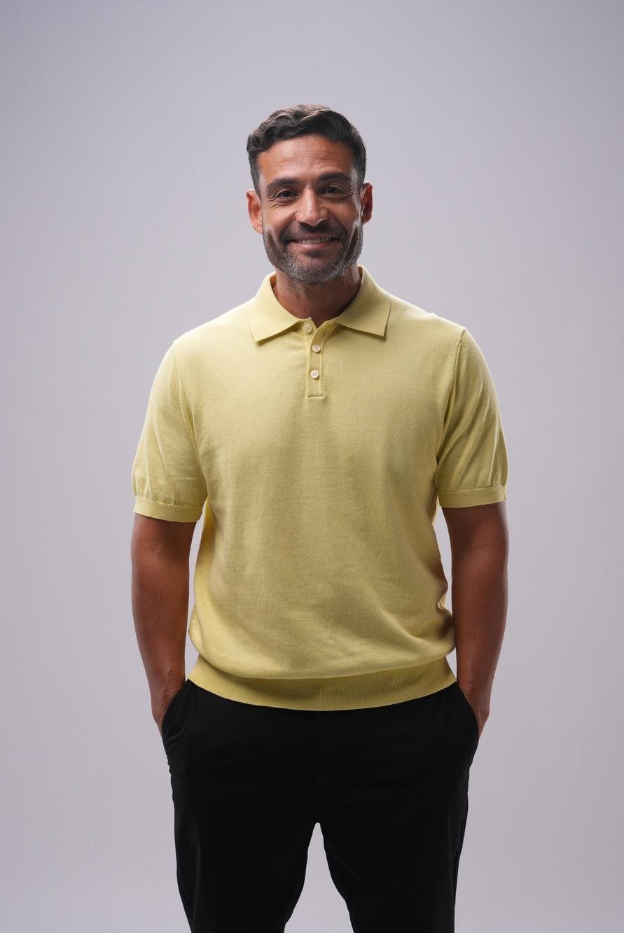 Islam Fawzy in a yellow polo shirt